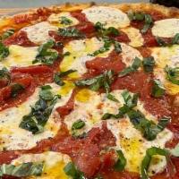 Margherita Pie · light sauce, San Marzano tomatoes, fresh mozzarella cheese, finished with basil, Cardena's S...