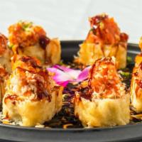 'Volcano Roll · Spicy. Yellowtail, salmon, crabmeat, avocado and cream cheese; tempura deep fry with chef's ...