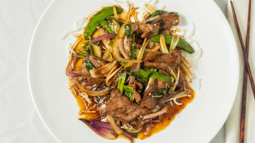 Mongolian Beef · Spicy. Shredded beef sautéed with scallions, onions, & snow peas in savory spicy brown sauce.