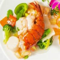 Seafood Combination · Jumbo shrimp, salmon, scallop, crabmeat and lobster sautéed with mixed veggie in a delicate ...