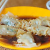 Dumplings · 5 pieces. Choice of fillings served with garlic soy vinaigrette.