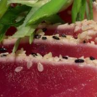 Tuna Sashimi App · Rare Yellowfin Tuna pan seared with black and white sesame seeds, served with pickled ginger...