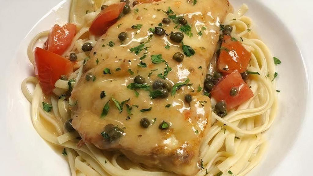 Haddock Piccata Dinner · Wild Atlantic Haddock pan seared with butter, lemon, tomato, garlic, and capers served over linguini