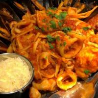 Mussels & Calamari Fra Diavolo · Mussels and Calamari tossed in Spicy red sauce served over linguini