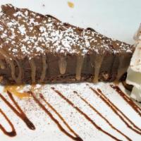 Chocolate Torte · Homemade flourless chocolate cake, pecan crust, and homemade caramel drizzle (gluten free). GF