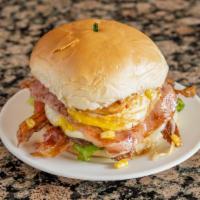 Bakes And Cakes Burger · Beef patty, chicken breast, ham, cheese, bacon, egg, lettuce, tomato, corn, potato sticks an...