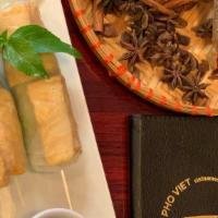 Veggie Spring-Rolls With Tofu (2 Rolls) · Rice papers, vermicelli, fried tofu, basils, lettuce, Vietnamese pickles, served with peanut...
