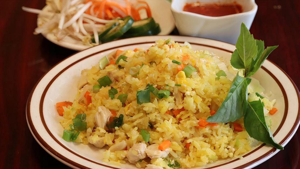 Boneless Chicken Rice · 580 Calories steamed white rice served with grilled chicken, tomatoes, lettuces, cucumbers, basils, vietnamese pickles, fish sauce and small bowl of chicken broth.