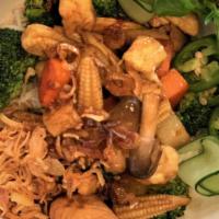 Dn21. Veggie Noodles · Vermicelli served with fried tofu, broccolis, lettuce, cucumbers, basils, Vietnamese pickles...