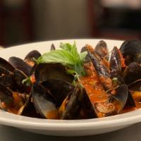Mussels Fra Diavolo · Mussels, garlic and spicy marinara sauce.