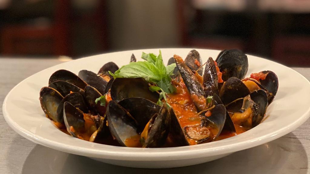 Mussels Fra Diavolo · Mussels, garlic and spicy marinara sauce.