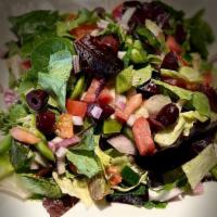 Garden Salad · Chopped spring mix with tomatoes, onions, kalamata olives, green peppers and EVOO vinaigrette.