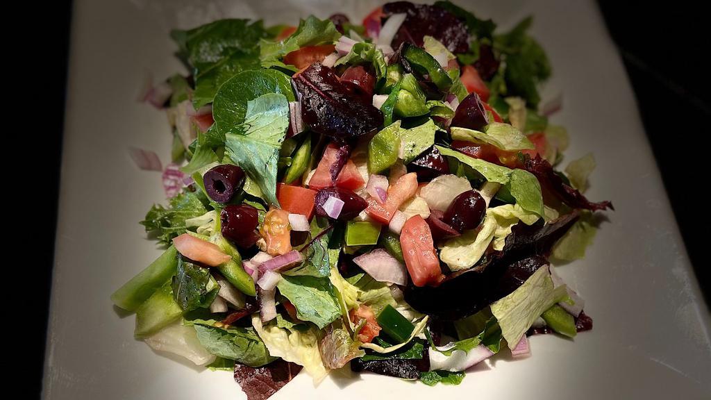Garden Salad · Chopped spring mix with tomatoes, onions, kalamata olives, green peppers and EVOO vinaigrette.
