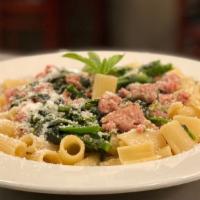 Uncle Tony'S Macaroni · Broccoli Rabe, garlic and sausage with baby rigatoni and parmigiano cheese.