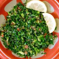 Tabbouleh · Finely chopped parsley, mint, bulgur, tomatoes, olive oil, salt & lemon juice, mixed to perf...