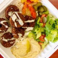 Falafel · Ground chick peas, Arabic spices, fried and served over a bed of pickles & rice. Topped w/ T...