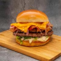 Truffle Burger · Two 3oz. ground beef patties with cured Applewood bacon, truffle mayo, cheddar cheese, lettu...