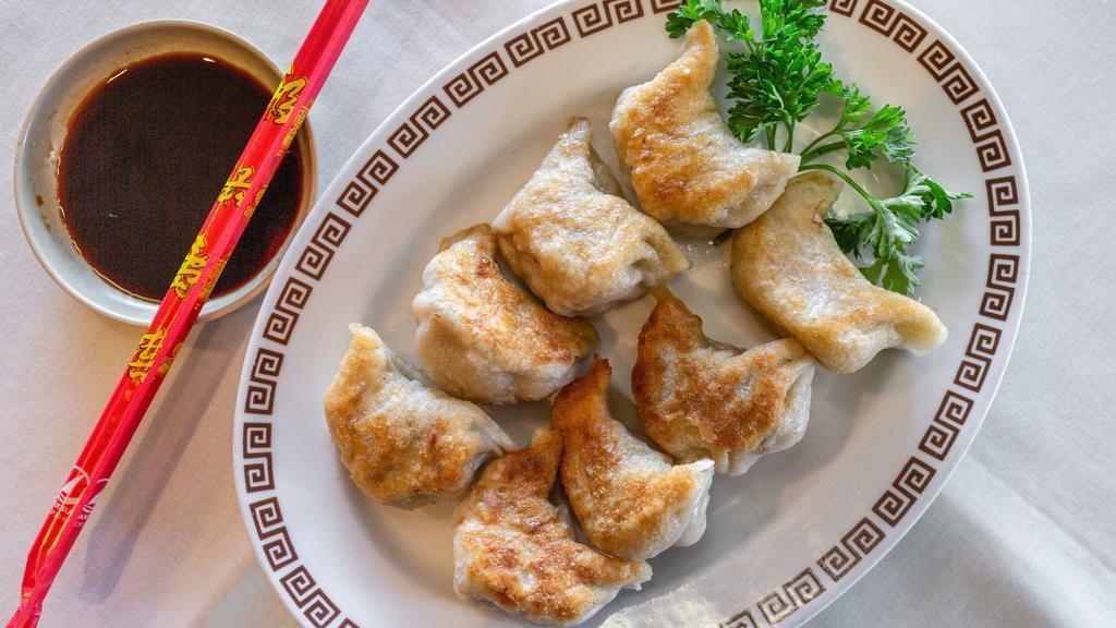 Dumpling (8) · 8 pieces. steamed or pan-fried.