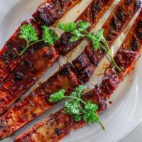 Honey Glazed Barbecue Spare Ribs · Ribs that have been broiled roasted or grilled.