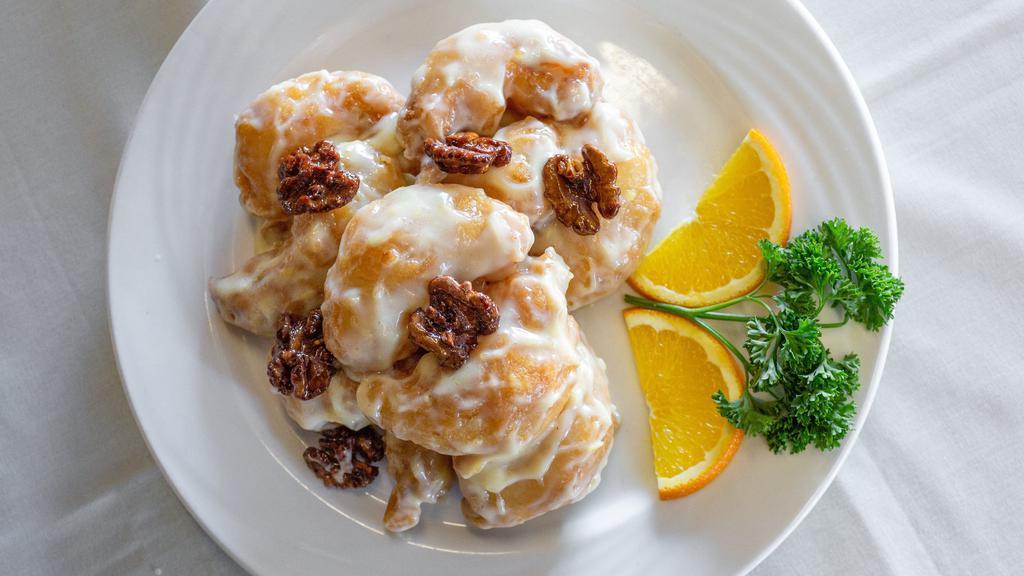 Grand Marnier Honey Walnut Shrimp · Jumbo shrimp lightly-fried sauteed in a fruity grand marnier flavored creamy sauce and sprinkled with honey walnuts.