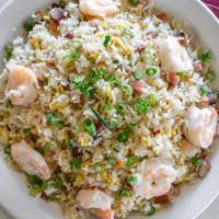 Young Chow Fried Rice · Combination of shrimp pork ham and vegetables stir-fried with rice.