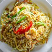 Singapore Angel Pasta · Fine rice noodles pan-seared with shrimp roast pork and vegetables flavored in curry.