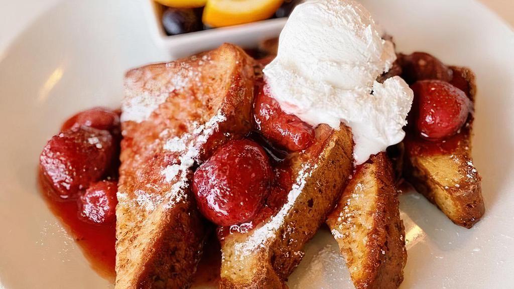 Strawberry Just The Toast · Two thick cut slices of house made bread dipped in egg custard and grilled.  Layered with vanilla pastry cream, strawberry sauce, and coconut whipped cream. Allergens: Coconutmilk, Egg. This item is dairy free