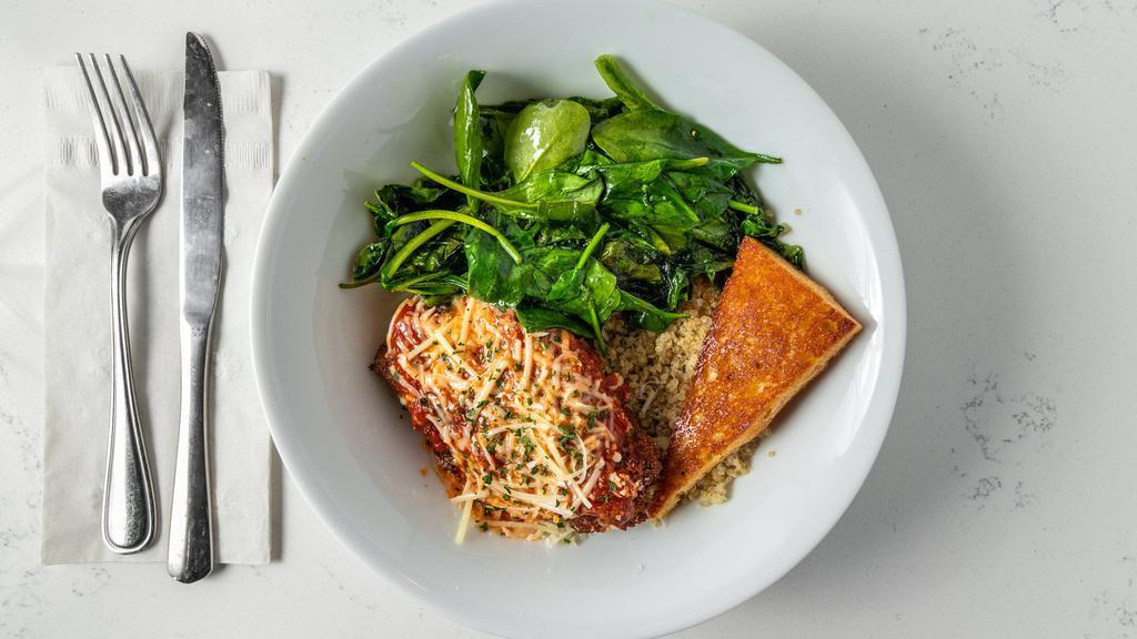 Chicken Parm Bowl · Our crispy chicken parmesan served over quinoa with sautéed garlic spinach.  Topped with our house made marinara and served with garlic toast. Allergens:  Eggs, Dairy.  For Dairy Free, simply sub cheese for dairy free.