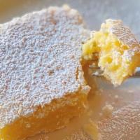Lemon Square · Our very popular lemon square cut into an individual serving size.  Shortbread crust filled ...