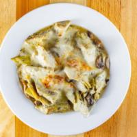 Artichoke Hearts · Sautéed in a garlic and wine sauce with mushrooms topped with Mozzarella cheese.