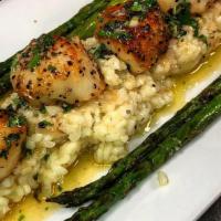 Pan Seared Scallops · Pan seared scallops lightly buttered in white wine sauce served over risotto with asparagus ...