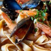 Fettuccine Di Mare (Mussels & Shrimp Over Fettuccine) · shrimp & mussels in a spicy red or garlic butter wine sauce