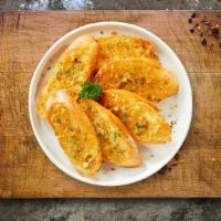 Garlic Bread  · (Vegetarian) Housemade bread toasted and garnished with butter, garlic, mozzarella cheese, a...