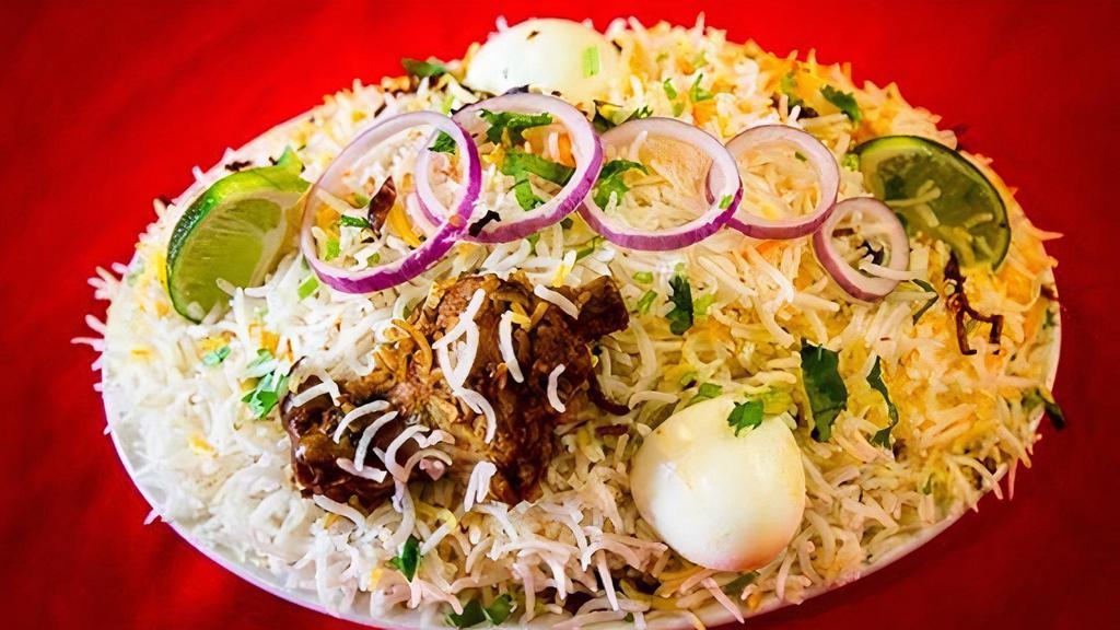 Hyderabadi Chicken Dum Biryani · Basmati rice cooked with chicken on dum over slow heat marinated with fresh herbs, spices and home-made biryani masala. Gluten free.