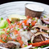 Churasca Steak · Grilled rib - eye, pepper jack, pico de gallo, avocados, grilled peppers & onions over romai...