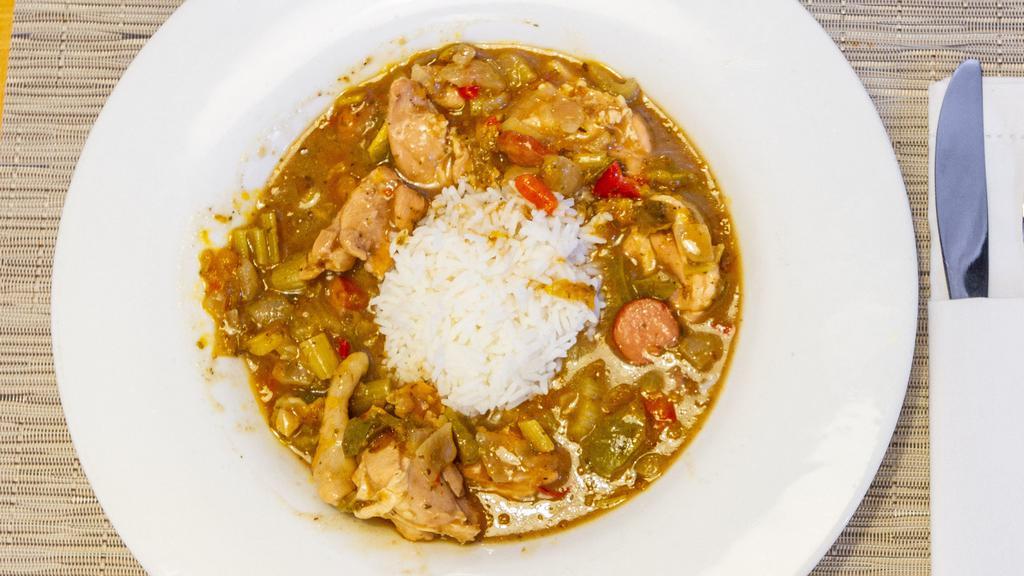 Gumbo · a bowl of goodness ! it contains shrimp, chicken and smoked beef sausage along with the trinity and cajun flavors of New Orleans.