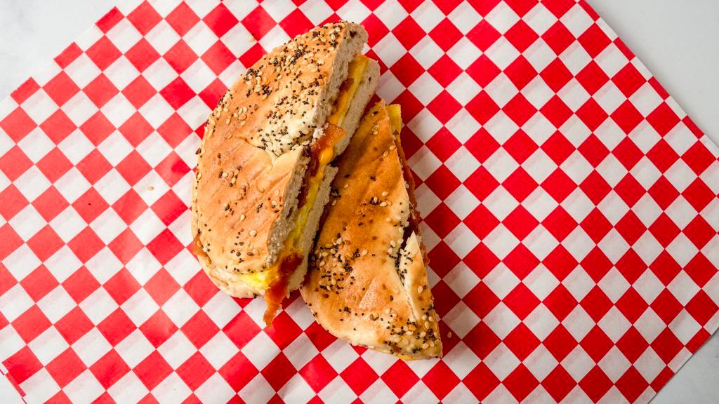 Bacon, Egg & Cheese Smash · Bacon with a fluffy scrambled egg topped with American cheese on your choice of bagel smashed in our panini press!