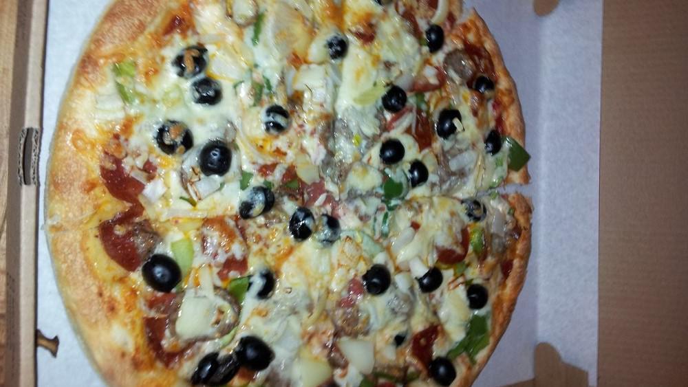 Vegetable Pizza · Peppers, onion, mushrooms, tomatoes, broccoli and olives.