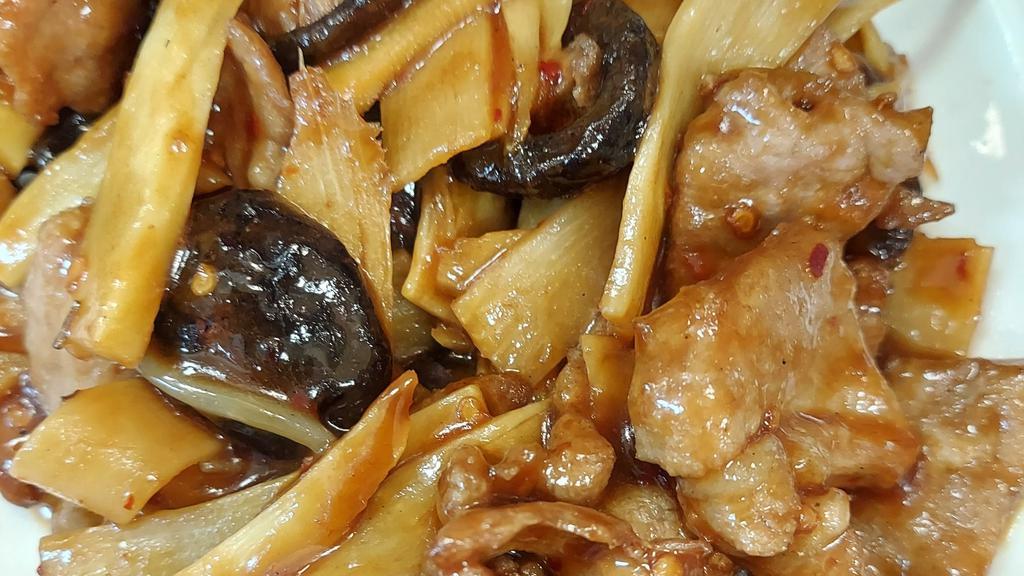 Hunan Pork · Spicy. Sliced pork sautéed with black mushrooms and bamboo shoots in a spicy black bean sauce.