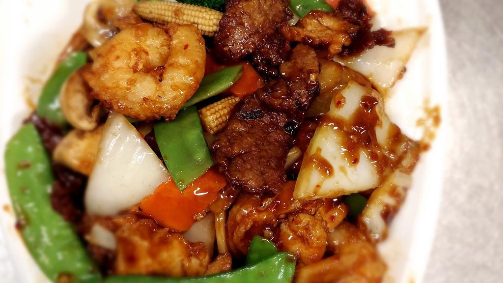 Triple Delight · Spicy. Shrimps, beef, and chicken with veggies in a special spicy ginger garlic sauce.