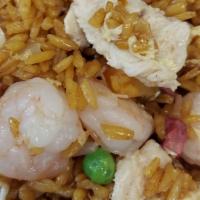 House Fried Rice · Rice stir-fried with soy sauce, shrimp, pork, chicken, eggs, and veggies.