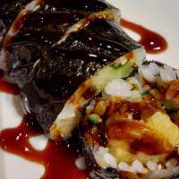 Crazy Maki · Shrimp tempura, cucumber, avocado, tobiko, with eel sauce.