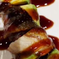 Black Dragon Roll · Spicy tuna roll with eel and avocado on top and eel sauce.