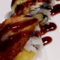 Alligator Maki · Shrimp tempura roll cover by eel, crab stick, and avocado with eel sauce.