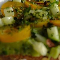 Avocado Toast  · Avocado toast , 
On multigrain toast , topped with tomato, cucumber, parsley and crushed red...
