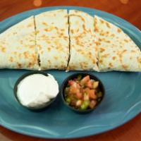 Steak Quesadilla · Toasted flour tortilla stuffed with cheese and your choice of grilled or shredded chicken. S...