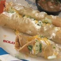 Taquitos · Rolled and fried corn tortillas filled with your choice of chicken or beef. Served with our ...