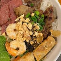 Bun Bon Mau · With combination of egg roll grilled pork slices, shrimps and shredded roast pork.