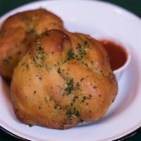 House Garlic Knots · With dipping sauce.