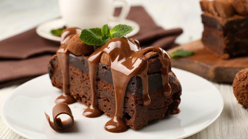 Chocolate Cake · A slice of our fresh made decadent chocolate sponge cake.